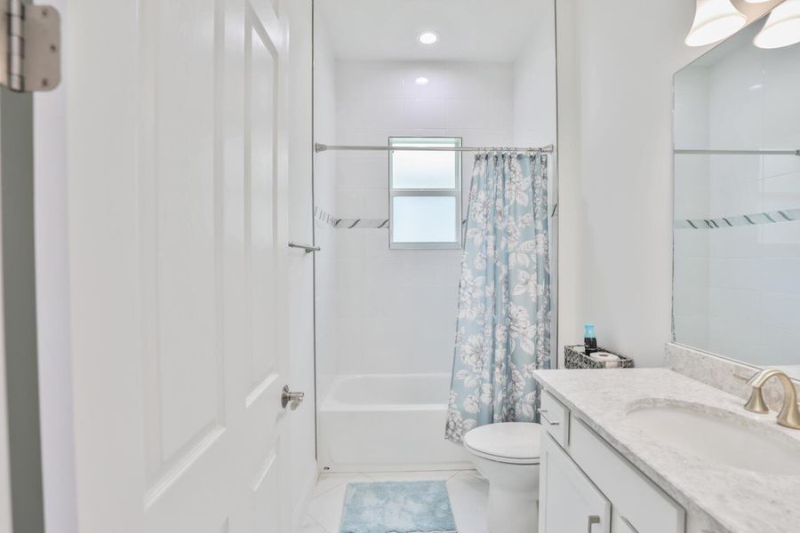 Furnished interior view inside a new home in PGA Village Verano, Port St. Lucie (Image 14).