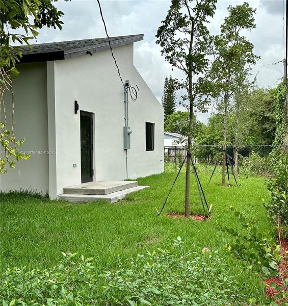 Front exterior of a new home in , Miami, FL, highlighting curb appeal (Image 24).