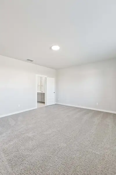 Primary Suite in the Haylee home plan by Trophy Signature Homes - REPRESENTATIVE PHOTO