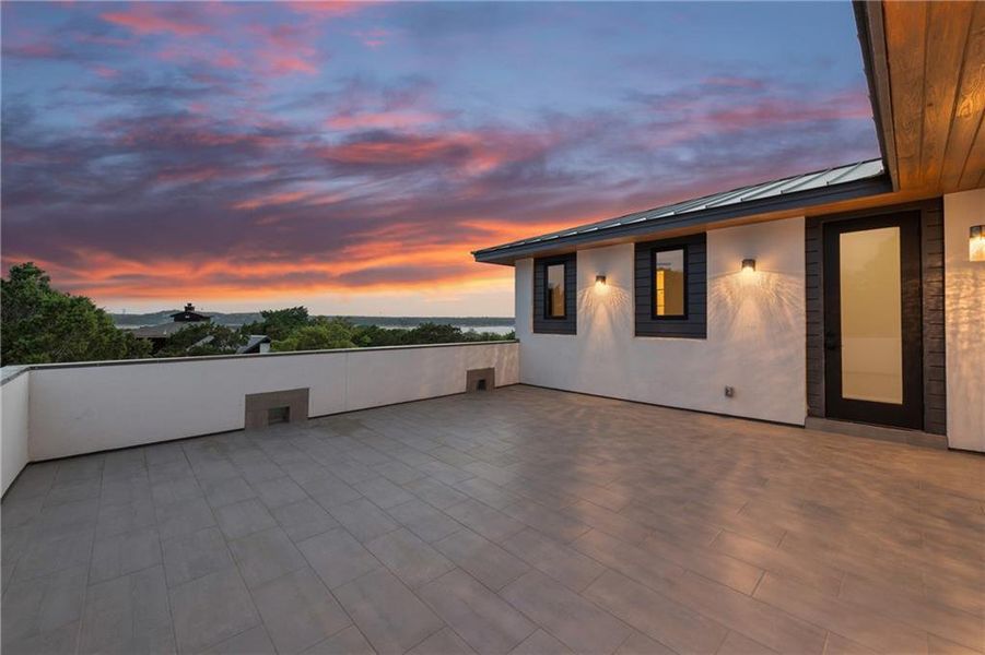 An inviting rooftop 3rd deck over the front offers unparalleled sunrise views, perfect for evening relaxation.