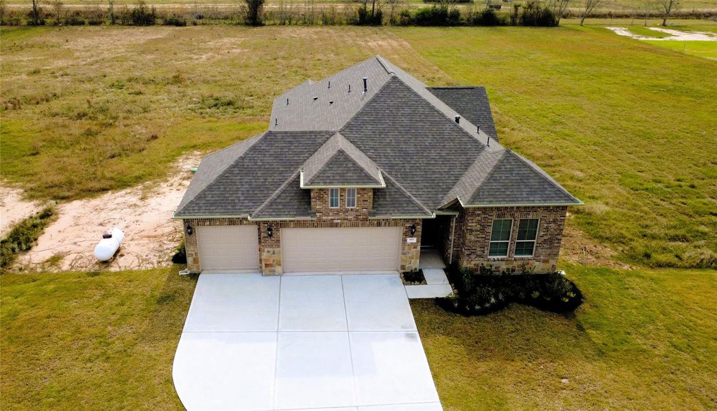 Front exterior of a new home in Barton Place, Cleveland, TX, highlighting curb appeal (Image 23). Front exterior of a new home in Barton Place, Cleveland, TX, highlighting curb appeal (Image 23).