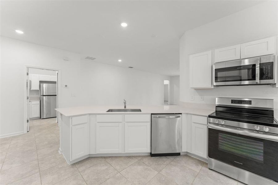 Furnished interior view inside a new home in Peace Creek Reserve, Winter Haven (Image 7).