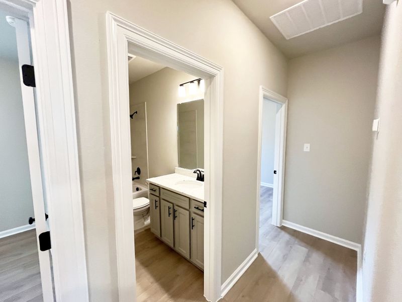 Front exterior of a new home in Emberly, Beasley, TX, highlighting curb appeal (Image 12).