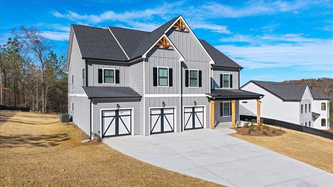 Front exterior of a new home in Silvercrest Lakes, Acworth, GA, highlighting curb appeal (Image 2). Front exterior of a new home in Silvercrest Lakes, Acworth, GA, highlighting curb appeal (Image 2).