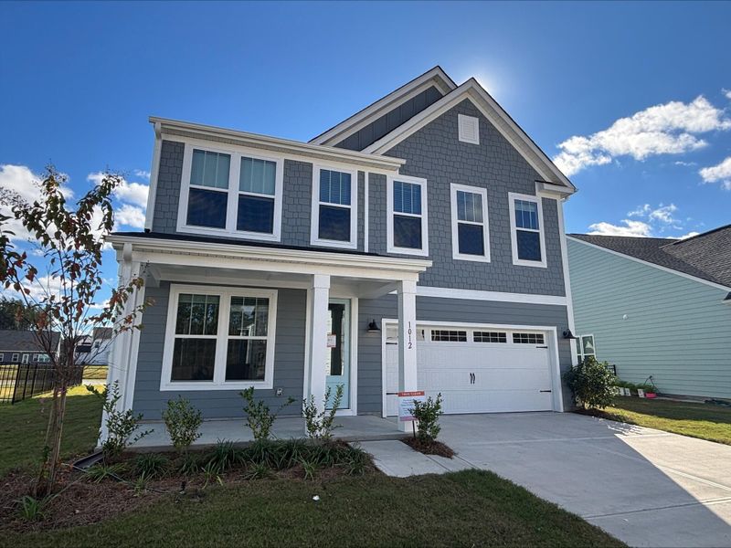 Front exterior of a new home in , Ravenel, SC, highlighting curb appeal (Image 1). Front exterior of a new home in , Ravenel, SC, highlighting curb appeal (Image 1).
