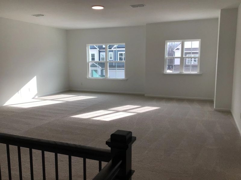 Loft featuring the AW Collection® Coastal - Flexible open space filled with natural light.