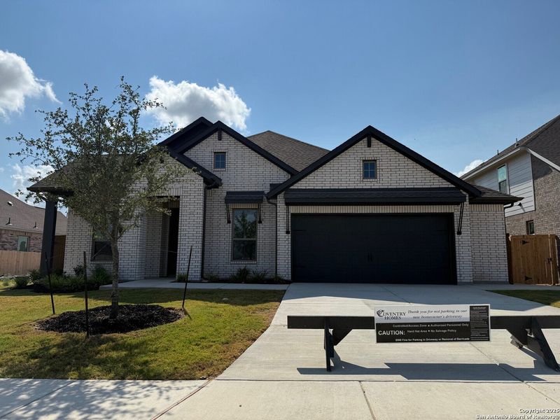 Front exterior of a new home in Stillwater Ranch, San Antonio, TX, highlighting curb appeal (Image 1). Front exterior of a new home in Stillwater Ranch, San Antonio, TX, highlighting curb appeal (Image 1).