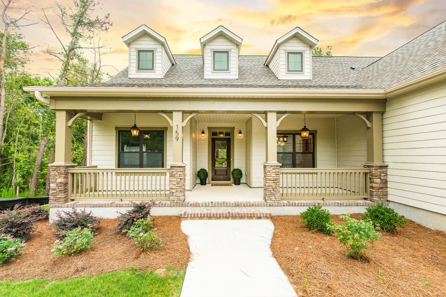 Representative exterior photo of a completed home built from the McKinley by Bill Clark Homes in The Sanctuary at Sunset Beach, Sunset Beach, NC (Image 30). Representative exterior photo of a completed home built from the McKinley by Bill Clark Homes in The Sanctuary at Sunset Beach, Sunset Beach, NC (Image 30).