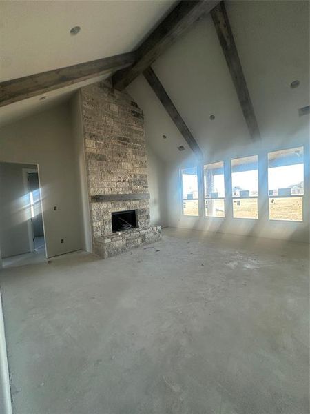 Living with fireplace and stained beams