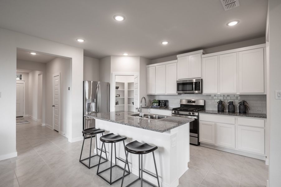 Representative furnished interior of a home built from the Caddo by Tri Pointe Homes in Mason Woods, Cypress (Image 50).