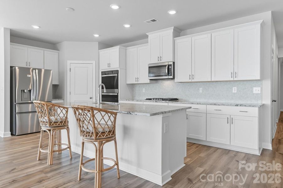 Furnished interior view inside a new home in Solena at the Vineyards II, Charlotte (Image 30).