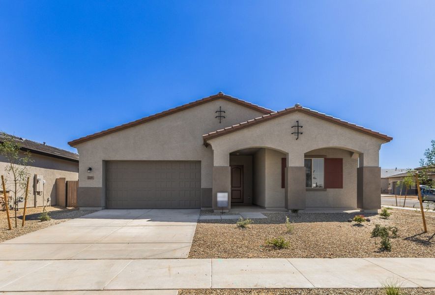 Front exterior of a new home in Frontera, Surprise, AZ, highlighting curb appeal (Image 1). Front exterior of a new home in Frontera, Surprise, AZ, highlighting curb appeal (Image 1).