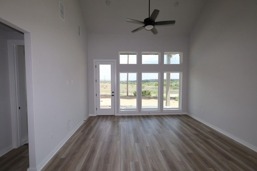 Spacious, unfurnished interior of a new home in Terrace Collection At Turner's Crossing, Buda (Image 9).