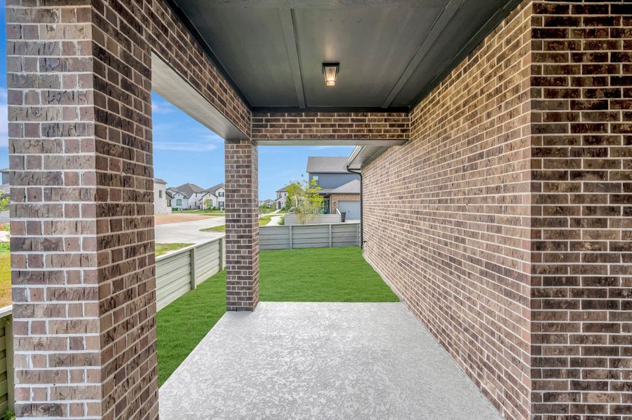 Exterior details and patio area of a home in Pomona - Grove Row Collection, Manvel (Image 3).