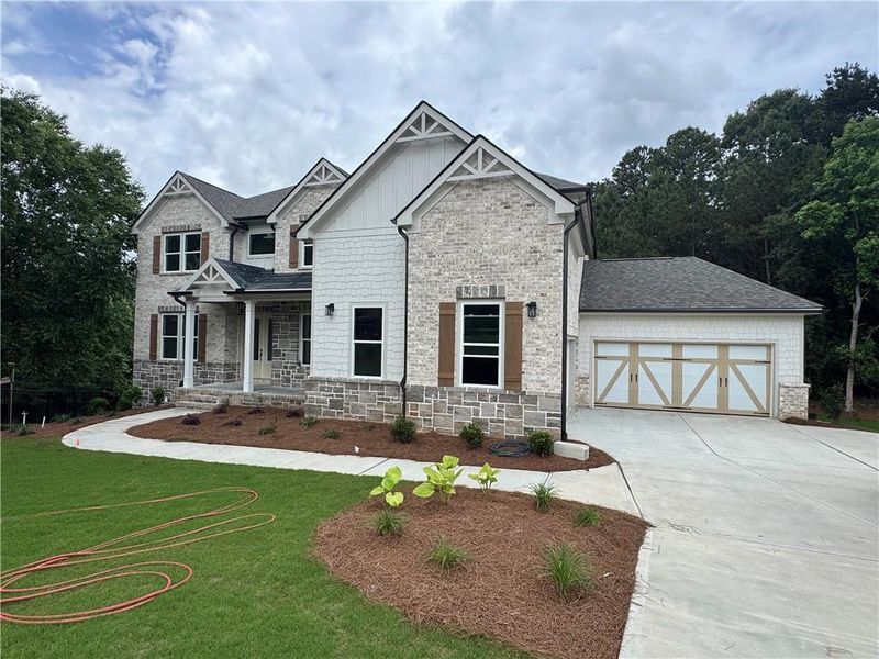 Front exterior of a new home in , Flowery Branch, GA, highlighting curb appeal (Image 16). Front exterior of a new home in , Flowery Branch, GA, highlighting curb appeal (Image 16).