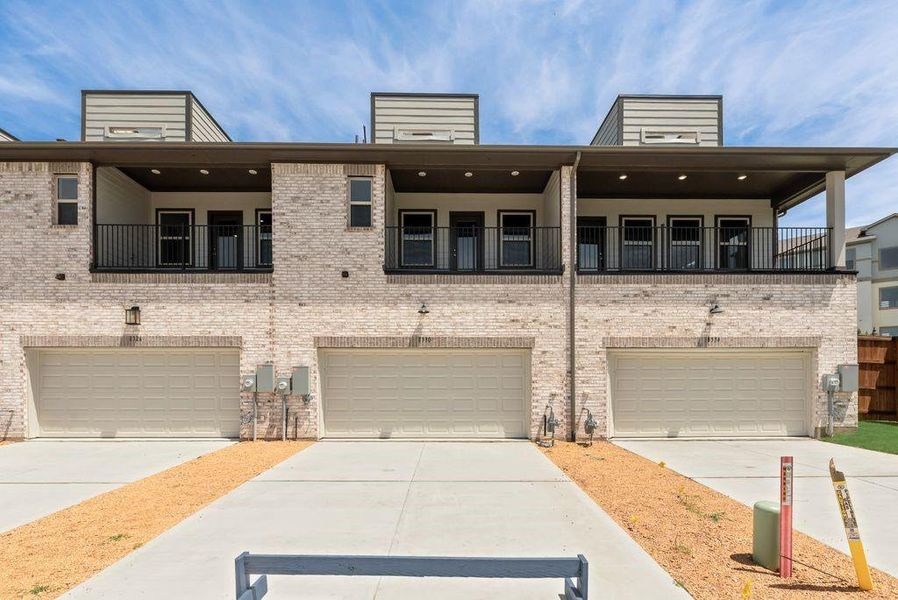 Front exterior of a new home in Bayside, Rowlett, TX, highlighting curb appeal (Image 22).