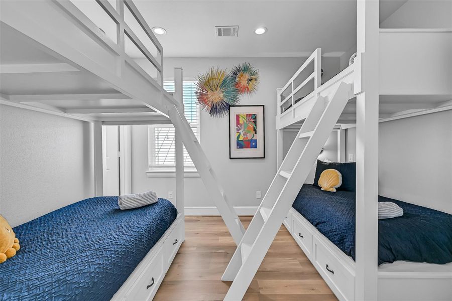 Built in bunk beds maximize sleeping capacity while keeping the room functional, efficient, and perfect for beach house living. Tis makes this home perfect for a short term rental!