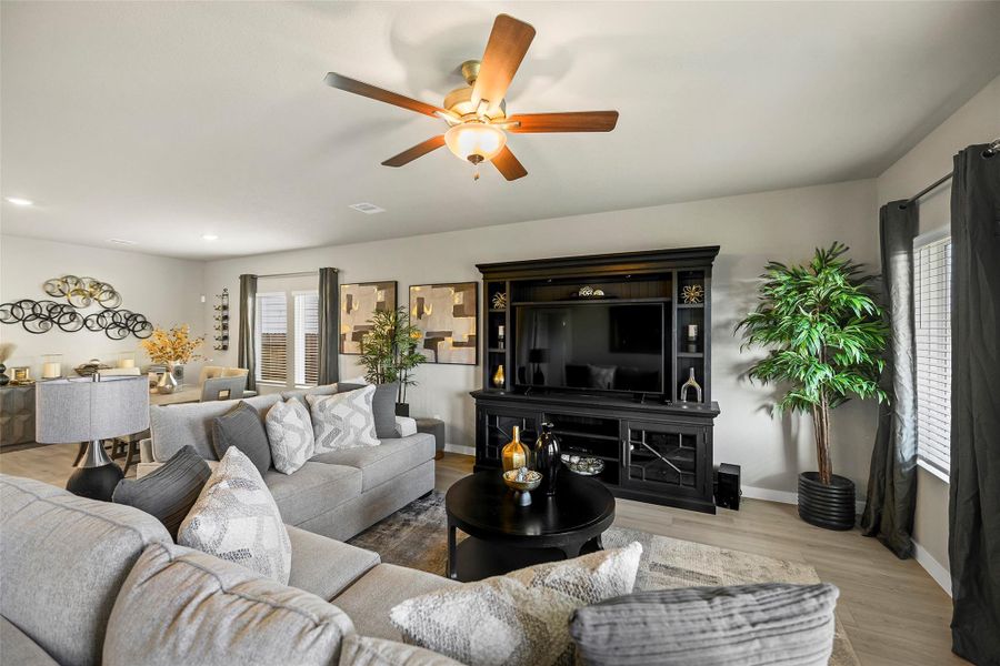 Spacious living area with an  abundance of natural light. Perfect for relaxation and entertaining.