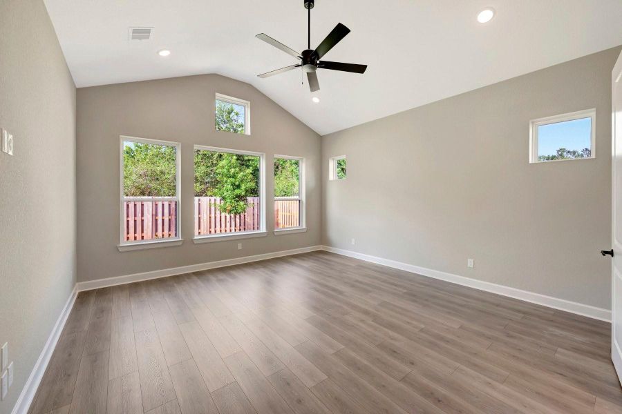 Spacious Master suite with vaulted ceiling and low maintenance flooring.  Lots of windows for light!