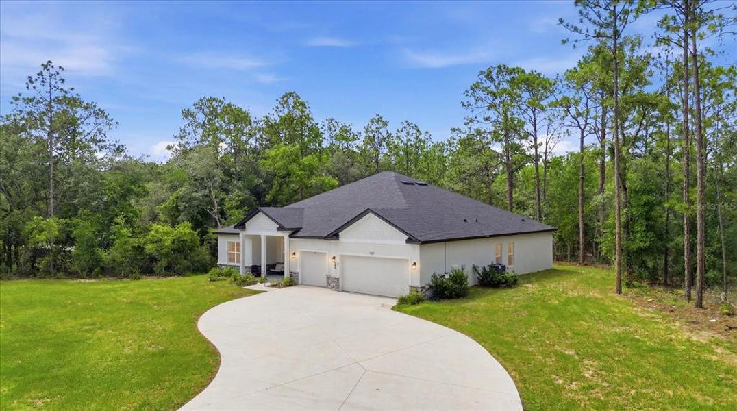 Front exterior of a new home in , Hernando, FL, highlighting curb appeal (Image 1). Front exterior of a new home in , Hernando, FL, highlighting curb appeal (Image 1).