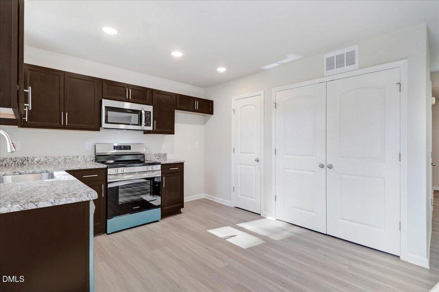 28-Kitchen pantry and storage area in ne