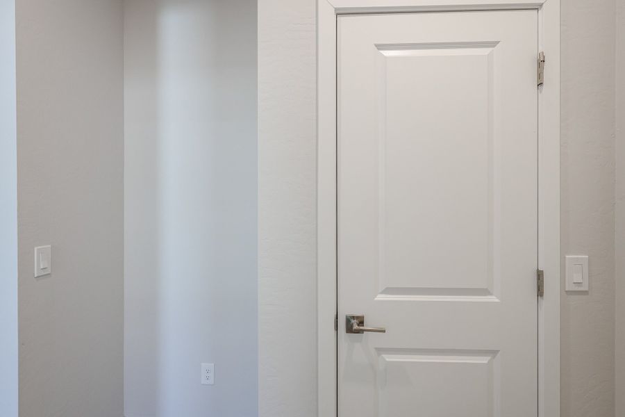 A white door with a handle.