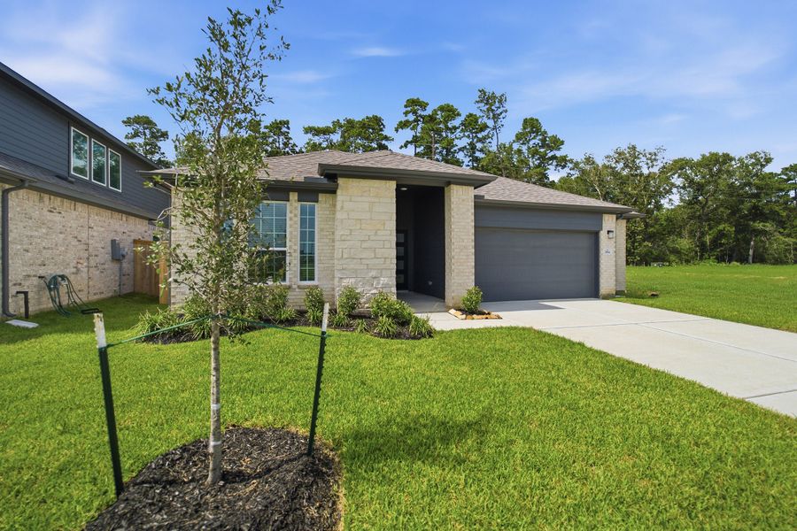 Front exterior of a new home in Sundance Cove, Crosby, TX, highlighting curb appeal (Image 2).