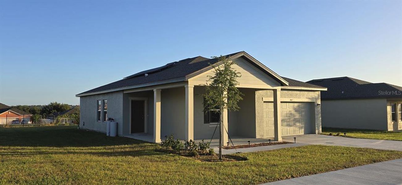 Front exterior of a new home in , Lake Wales, FL, highlighting curb appeal (Image 20). Front exterior of a new home in , Lake Wales, FL, highlighting curb appeal (Image 20).