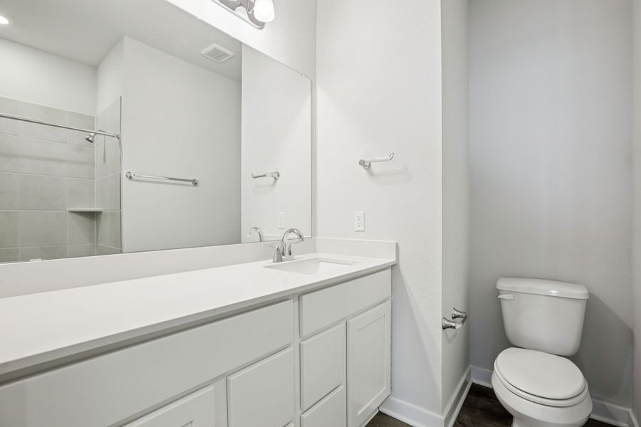 A bathroom with a standup shower. A bathroom with a standup shower.