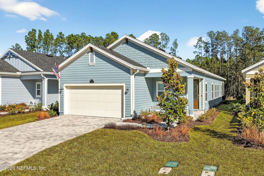 Front exterior of a new home in , St. Johns, FL, highlighting curb appeal (Image 23). Front exterior of a new home in , St. Johns, FL, highlighting curb appeal (Image 23).