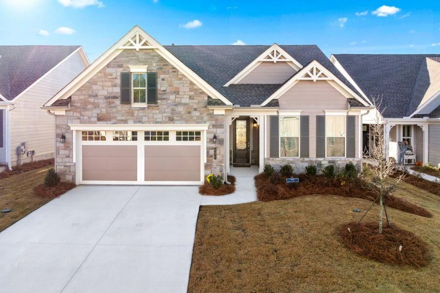 Front exterior of a new home in , Hoschton, GA, highlighting curb appeal (Image 27).