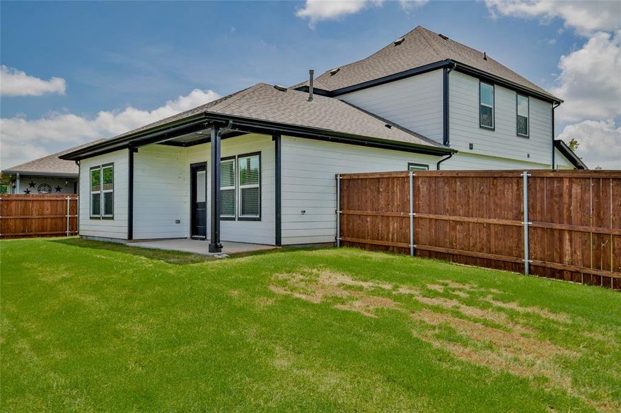 Back of property with roof with shingles and a patio Back of property with roof with shingles and a patio