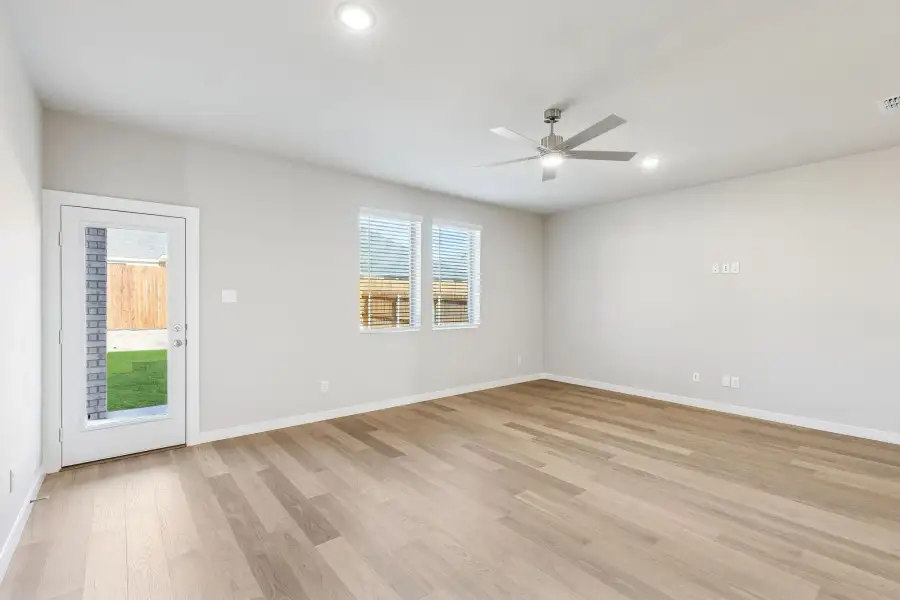 Living Room in the Haylee home plan by Trophy Signature Homes - REPRESENTATIVE PHOTO