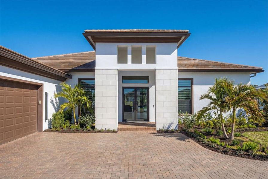 Front exterior of a new home in , Sarasota, FL, highlighting curb appeal (Image 30).