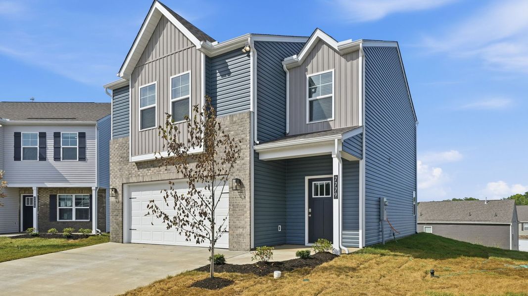 Front exterior of a new home in The Ridge at Neals Landing, Knoxville, TN, highlighting curb appeal (Image 18). Front exterior of a new home in The Ridge at Neals Landing, Knoxville, TN, highlighting curb appeal (Image 18).