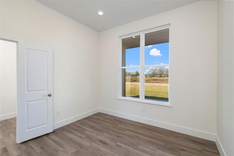 Spare room featuring hardwood / wood-style flooring