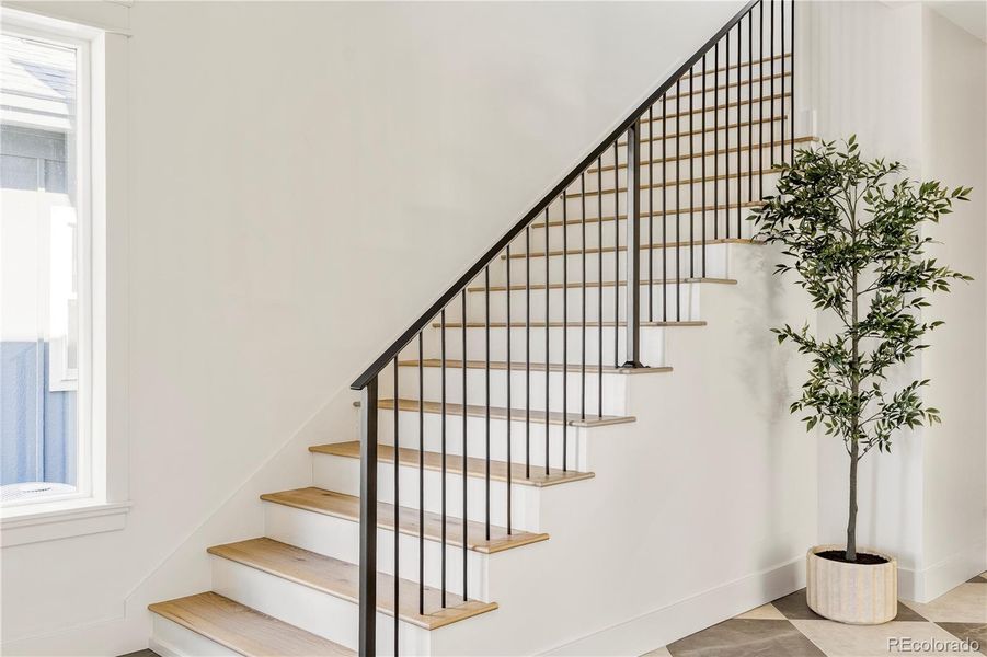 Architectural staircase with classic iron railing
