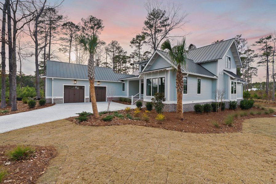 Front exterior of a new home in , Ravenel, SC, highlighting curb appeal (Image 2).