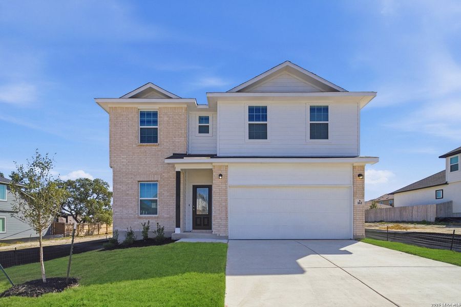 Front exterior of a new home in Hunter's Ranch, San Antonio, TX, highlighting curb appeal (Image 2).