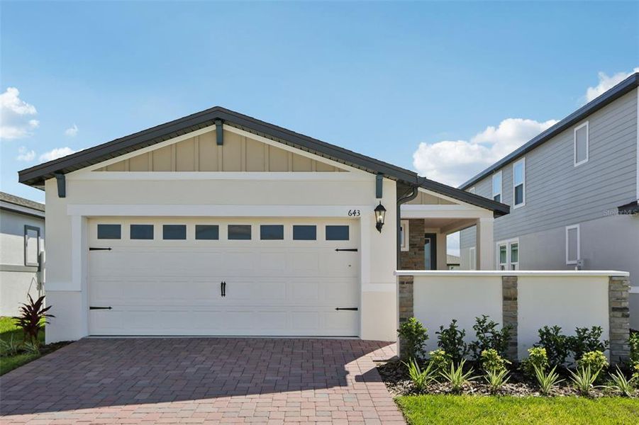 Front exterior of a new home in Springs at Lake Alfred - Classic Series, Lake Alfred, FL, highlighting curb appeal (Image 21).