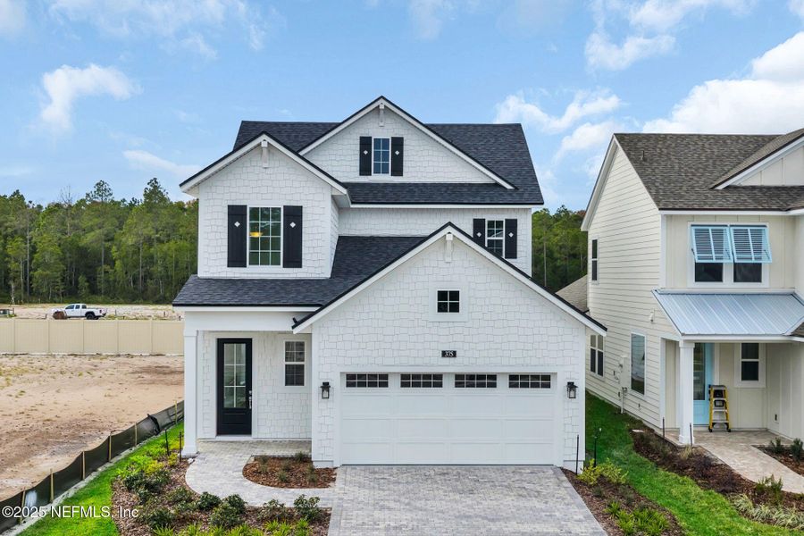 Front exterior of a new home in Seabrook Village at Seabrook, Ponte Vedra, FL, highlighting curb appeal (Image 23).