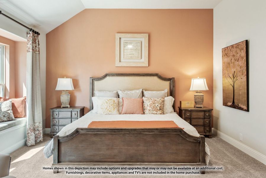 Bedroom with wood bed frame, peach accent wall, two nightstands, and a window seat with natural light Bedroom with wood bed frame, peach accent wall, two nightstands, and a window seat with natural light