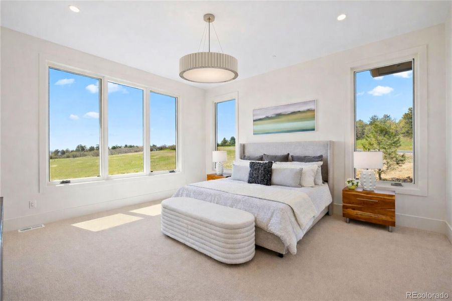 Another view of the primary bedroom.