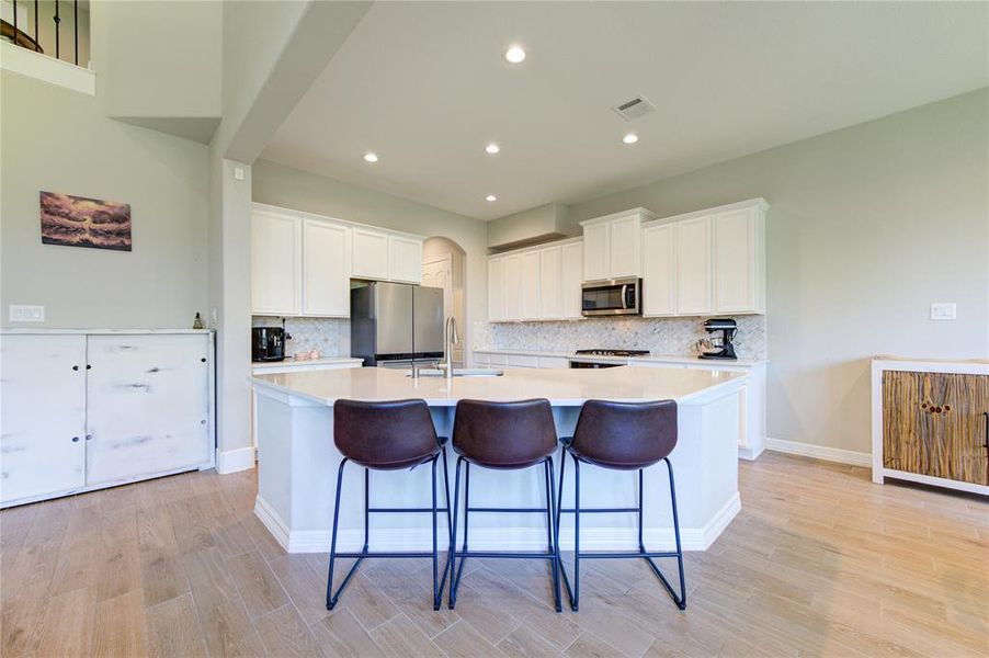 Kitchen with large center island, perfect for food preparation and entertainmen