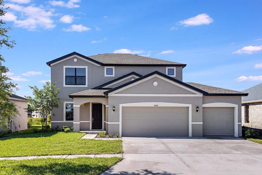 Representative exterior photo of a completed home built from the 50 ' - Saratoga by William Ryan Homes in Pinecone Reserve, Brooksville, FL (Image 33).