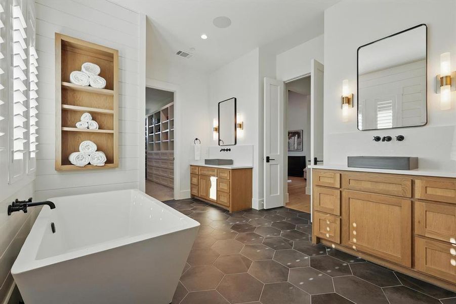 Bathroom with two vanities, a soaking tub, tile patterned flooring, and recessed lighting Bathroom with two vanities, a soaking tub, tile patterned flooring, and recessed lighting
