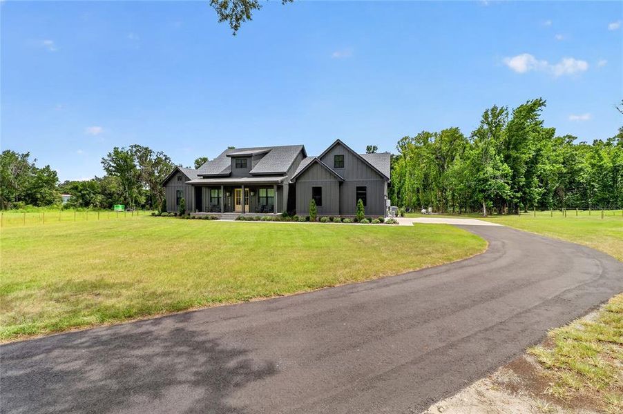 Front exterior of a new home in , Lakeland, FL, highlighting curb appeal (Image 26).