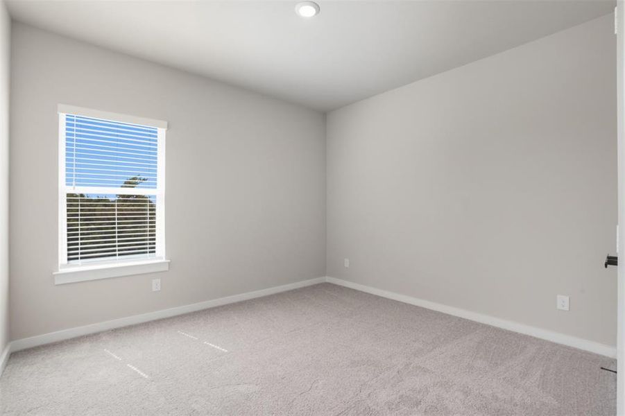 Empty room with carpet floors and recessed lighting Empty room with carpet floors and recessed lighting