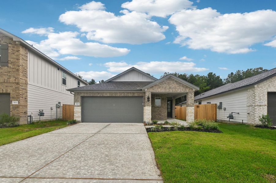 Front exterior of a new home in Landing Meadows - Traditional Series, New Caney, TX, highlighting curb appeal (Image 1).