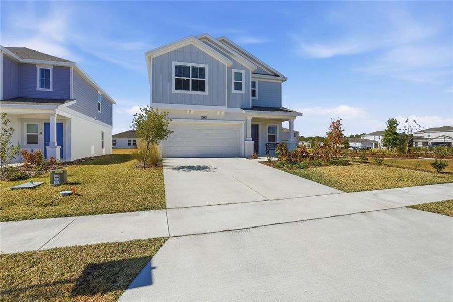 Front exterior of a new home in Westview, Kissimmee, FL, highlighting curb appeal (Image 23).
